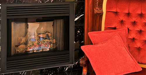 fireplace next to red chair