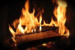roaring fire in a fireplace 