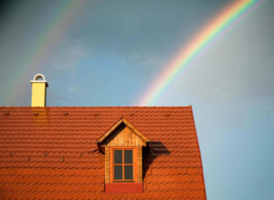 yellow chimney with rainbow in the back