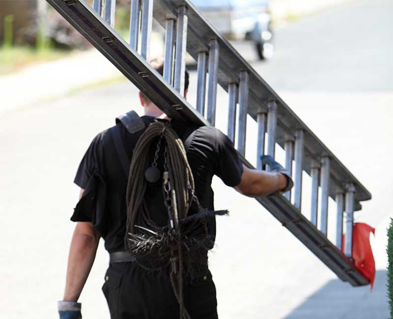 Tech carrying safety equipment and ladder.